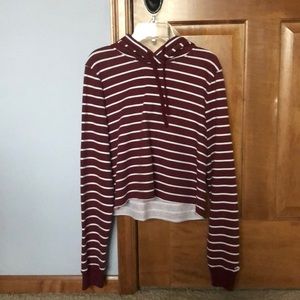 Burgundy and white striped cropped hoodie.